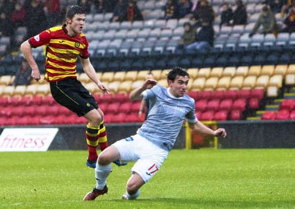 Blair Spittal strikes to fire Partick Thistle ahead. Pic: SNS/Bruce White