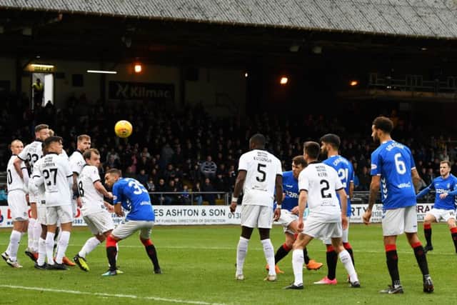 Andy Halliday curls in a delightful free-kick to draw Rangers level at Dens Park. Picture: SNS.