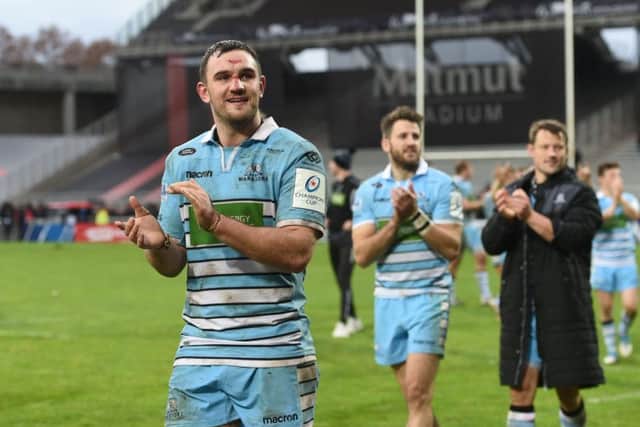 Adam Ashe, foreground, celebrates with Tommy Seymour after Glasgows win in Lyon on Saturday. Picture: SNS/SRU.