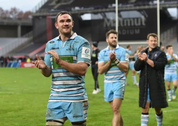 Adam Ashe, foreground, celebrates with Tommy Seymour after Glasgows win in Lyon on Saturday. Picture: SNS/SRU.