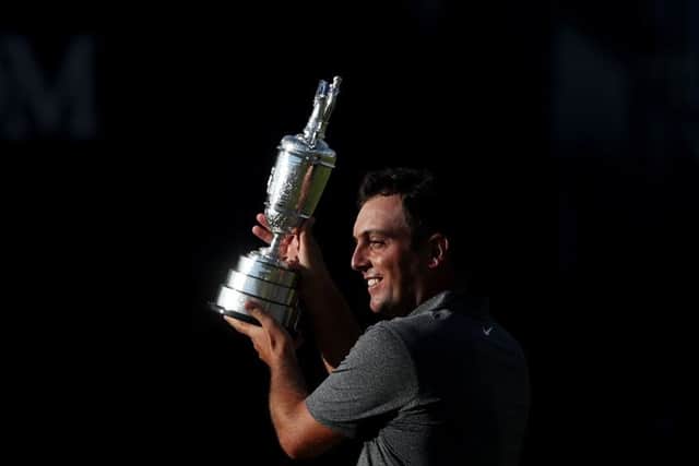 Francesco Molinari shows off his European Tour Golfer of the Year award. Picture: PA.