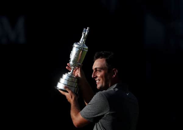 Francesco Molinari shows off his European Tour Golfer of the Year award. Picture: PA.