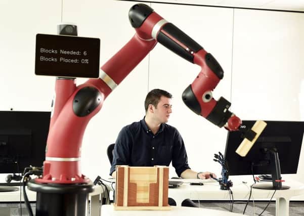 Sawyer, a collaborative robot which works alongside people to reduce safety risks, practices at CSIC's Innovation Factory. Picture: Andy Buchanan