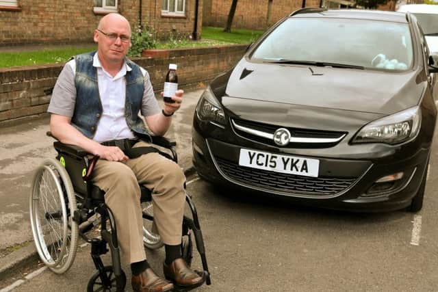 Disabled wheelchair user Stephen Scott,52, who has been told he will no longer receive the benefit he uses to pay for his mobility car after he managed to pass an assessment by Department of Works and Pensions Picture: SWNS