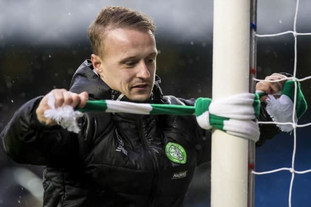 Leigh Griffiths ties a Celtic scarf to a goalpost in Ibrox after a 2-1 win over Rangers in December 2016. Picture: SNS Group