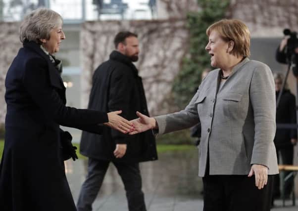 Angela Merkel with Theresa May.  (AP Photo/Michael Sohn)