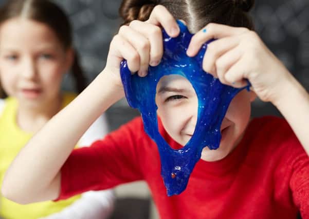 Children playing with the blue slime being sold by major UK toy retailers