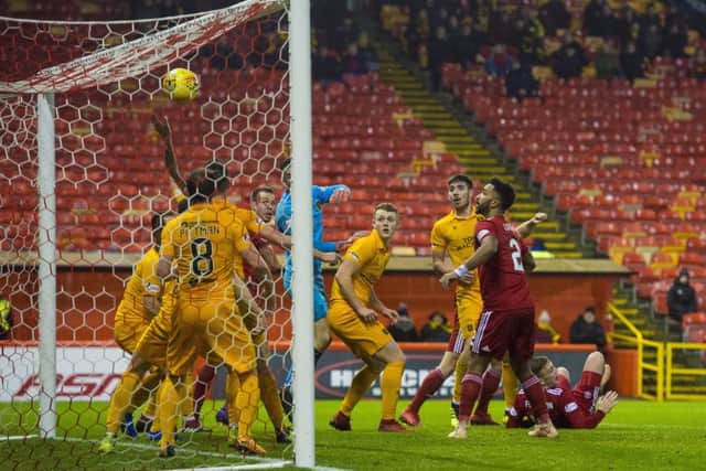 Aberdeen's Lewis Ferguson, right, is grounded after his late winner. Picture: Alan Harvey/SNS