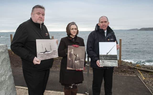 Iain Maciver and Anne Frater, descendants of the Iolaire tragedy, with Western Isles Convener Norman A Macdonald, at the memorial in Stornoway, which overlooks the site of the wreck of the HMY Iolaire. Picture: Lenny Warren/PA Wire