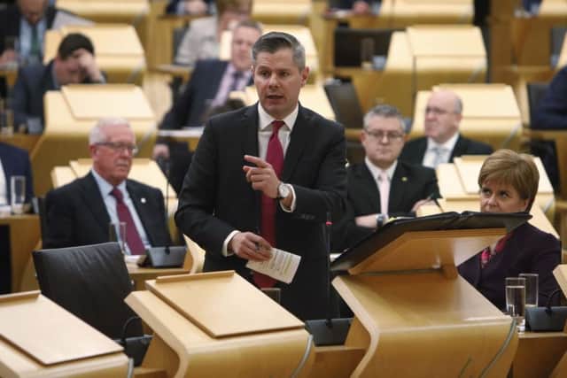 Finance secretary Derek Mackay speaks in the chamber of the Scottish Parliament about his spending and tax plans for 2019/20. Picture: Andrew Cowan/Scottish Parliament