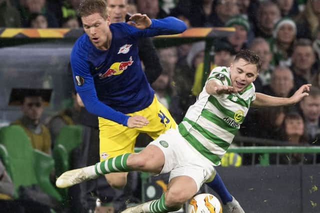 James Forrest battles with Marcel Sabitzer during Celtic's victory over RB Leipzig at Celtic Park.