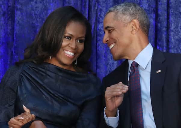 Michelle and Barack Obama are intellectual equals, but still she replaced the lost socks and made sure the kids had juice boxes (Picture: Mark Wilson/Getty)