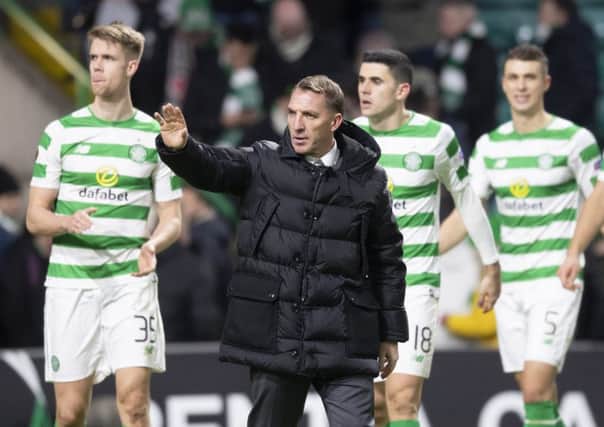 Celtic manager Brendan Rodgers celebrates qualification with his players at full time. Picture: Craig Williamson/SNS