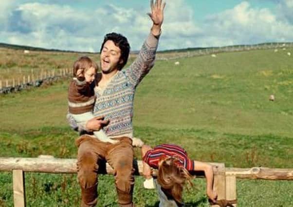 Linda McCartney captured this image of her husband Paul with children Mary and Heather in Campbeltown, Argyll, in 1970.