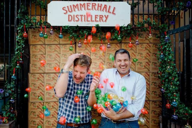Pickering's owners Marcus Pickering (L) and Matthew Gammell (R) with their festive gin baubles. Picture: Peter Dibdin