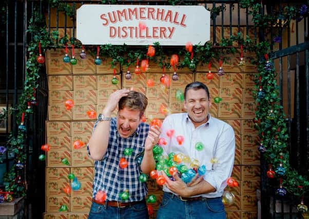 Pickering's owners Marcus Pickering (L) and Matthew Gammell (R) with their festive gin baubles. Picture: Peter Dibdin