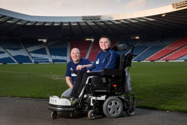 Connor Colhoun with Willie Pettigrew, chair of Scottish Powerchair football. Photograph: Robert Perry