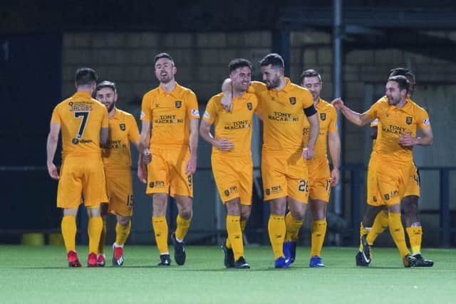 Ryan Hardie (centre left) celebrates his second goal with his Livingston team mates. Picture: SNS Group