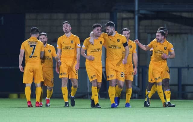 Ryan Hardie (centre left) celebrates his second goal with his Livingston team mates. Picture: SNS Group