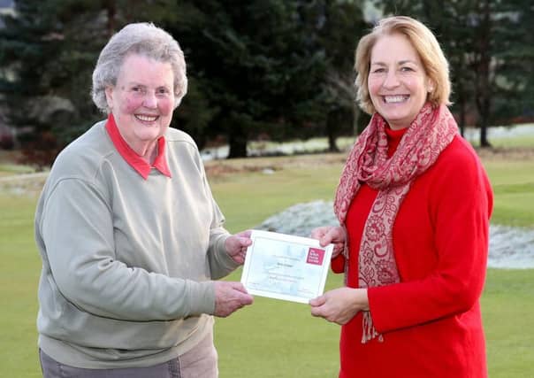 Helene Mauchline, (R) National Manager for The British Horse Society Scotland presents an Award to Ann Fraser for forty years long service as a Brtiish Horse Society volunteer.