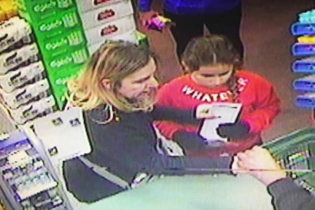 Sian Duili and daughter Aisha pictured in a Costcutter in Gretna. Picture: South Wales Police