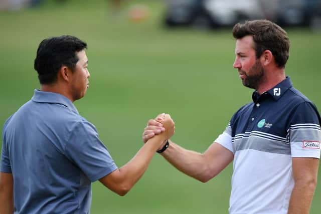 Scott Jamieson, right, congratulates David Lipsky after he was overtaken by the American in the final round. Picture: Stuart Franklin/Getty