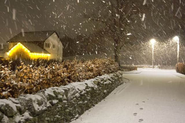 Snow falling in the Borders on Saturday as Storm Deirdre brought treacherous driving conditions. Picture: PA