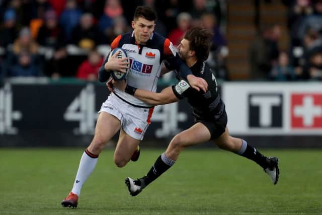 Blair Kinghorn is tackled by Newcastle Falcons' Johnny Williams. Picture: PA
