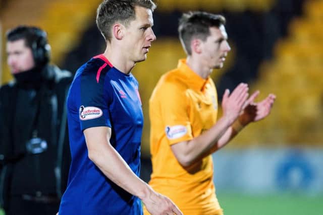 Hearts captain Christophe Berra cuts a dejected figure after the Livingston defeat. Picture: SNS
