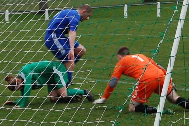 Thornton Hibs v Bathjgate Thistle Garry Thomson with the ball between his feet. David Taylor and goalie, Michael McGhee, were able to clear.