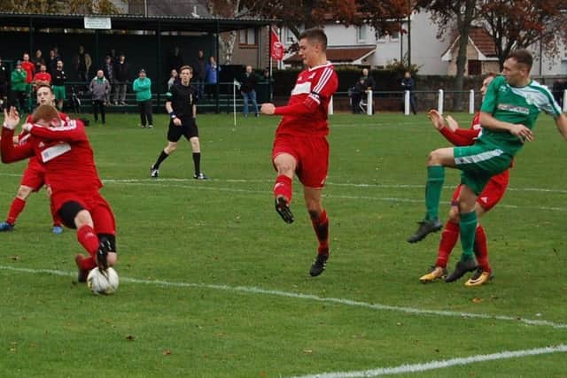 Glenrothes defender Gary Pearson makes a great block to deny Daniel McNab of Thornton Hibs