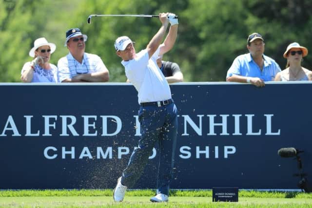 David Drysdale tees off at the fifth hole in the Alfred Dunhil Championships in South Africa .
