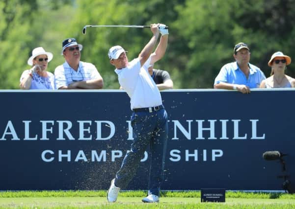 David Drysdale tees off at the fifth hole in the Alfred Dunhil Championships in South Africa .