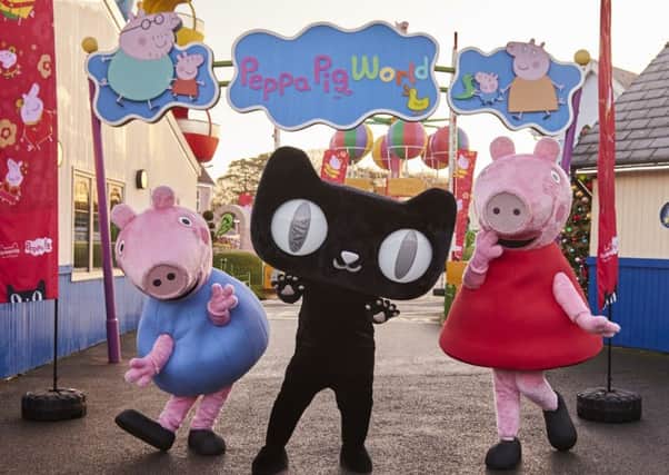 George, Tmall cat, and Peppa Pig at Paultons Park, home of Peppa Pig World, in celebration of Peppa Pig recently being named a super brand by the worlds biggest e-commerce platform, TMall. Picture: Contributed