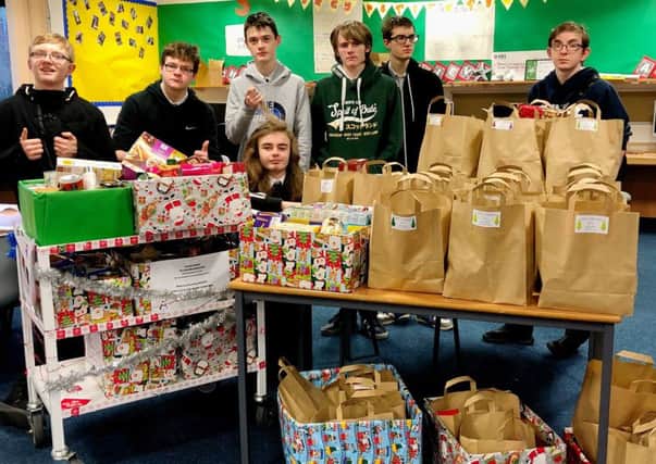 ACHIEVE students at Rothesay Joint Campus with some of the hampers they collected.