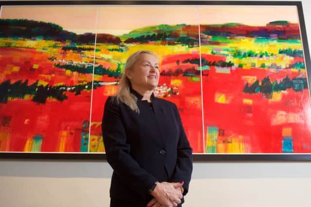 Executive chairman Audrey Baxter in front of a Francis Boag painting commissioned to celebrate the company's 150th anniversary. Picture: Contributed