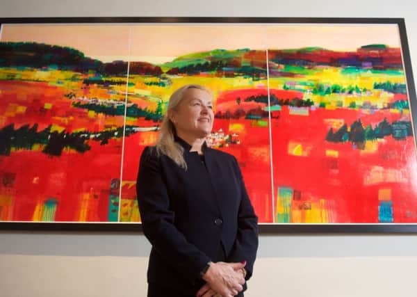 Executive chairman Audrey Baxter in front of a Francis Boag painting commissioned to celebrate the company's 150th anniversary. Picture: Contributed
