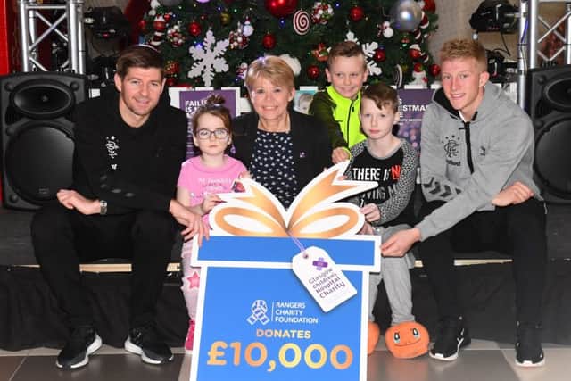 Steven Gerrard and Ross McCrorie, far right, at the Â£10,000 cheque handover to the Royal Hospital for Sick Children in Glasgow. Picture: SNS Group