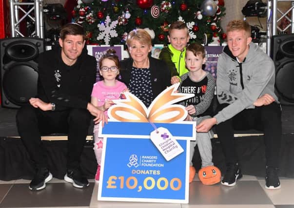 Steven Gerrard and Ross McCrorie, far right, at the Â£10,000 cheque handover to the Royal Hospital for Sick Children in Glasgow. Picture: SNS Group