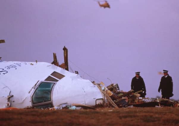 Officials inspect the wreckage of Pan Am flight 103 in Lockerbie. Picture: George DeKeerle/Getty