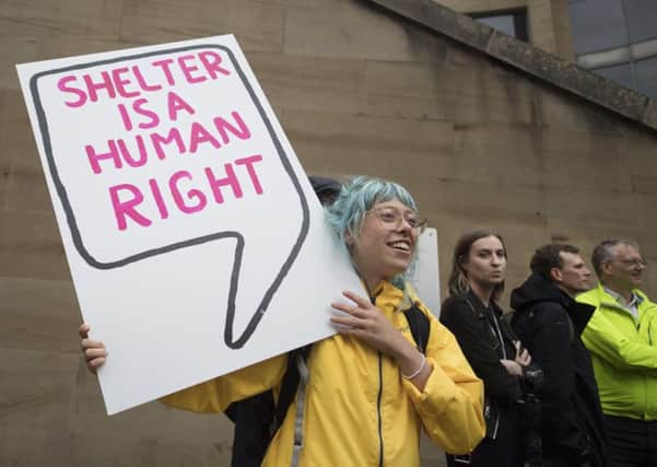 Campaigners against forced evictions in Glasgow stage a protest in July. Picture: John Devlin