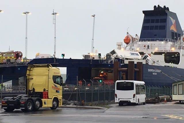 Lorries have overturned on a ferry docked at Cairnryan in high winds, prompting a major emergency response. Picture: BBC
