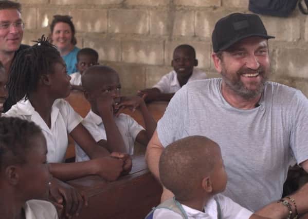 Scots actor Gerard Butler travelled to Haiti to direct a school nativity play. Picture: Mary's Meals/PA