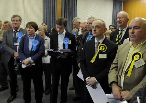 Tory and SNP members stand awaiting the results of a by-election in the Bonnybridge and Larbert ward of Falkirk Council in February. The seat was eventually won by the Nationalists. Picture: Michael Gillen