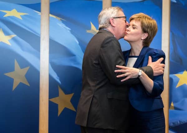 Kissey-kissey: Jean-Claude Juncker greets Nicola Sturgeon in his usual manner