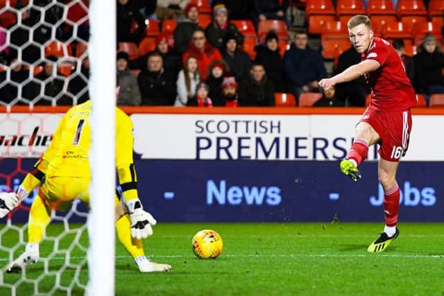 Sam Cosgrove fires home Aberdeen's second in their 5-1 win over Dundee.