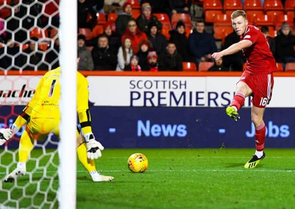 Sam Cosgrove fires home Aberdeen's second in their 5-1 win over Dundee.