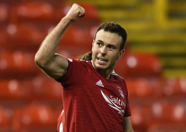 Andrew Considine celebrates after scoring  Aberdeen's fifth in their 5-1 win over Dundee.