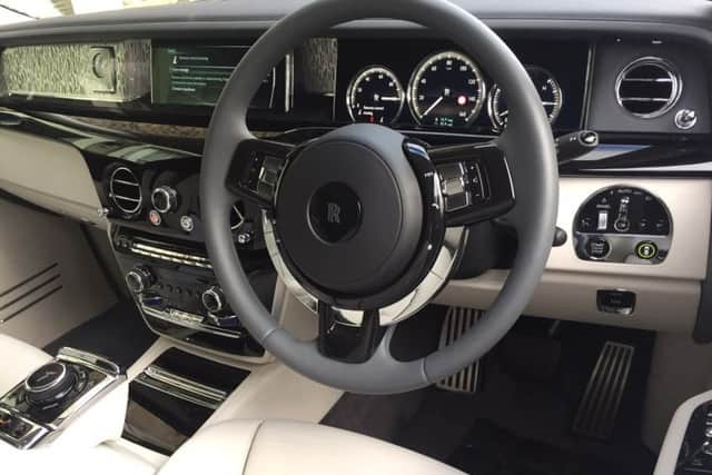 The only indication that the engine of the Rolls-Royce Phantom has started is a dial showing the power reserve has reached 100 per cent.