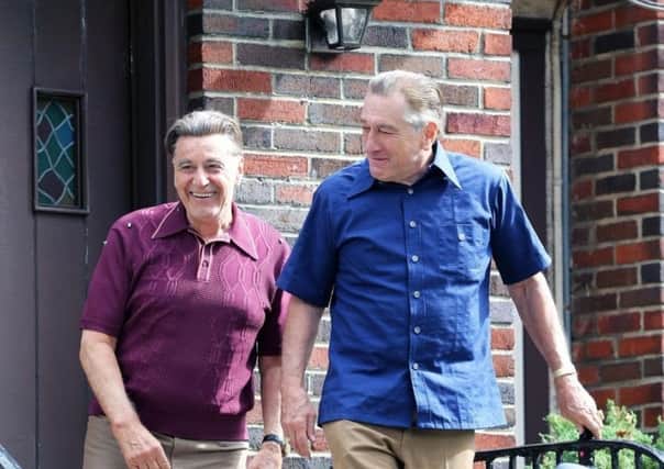Robert Di Niro and Al Pacino, Joe Pesci, left, and Martin Scorsese, far left, get together again as the old gang play younger versions of themselves in The Irishman